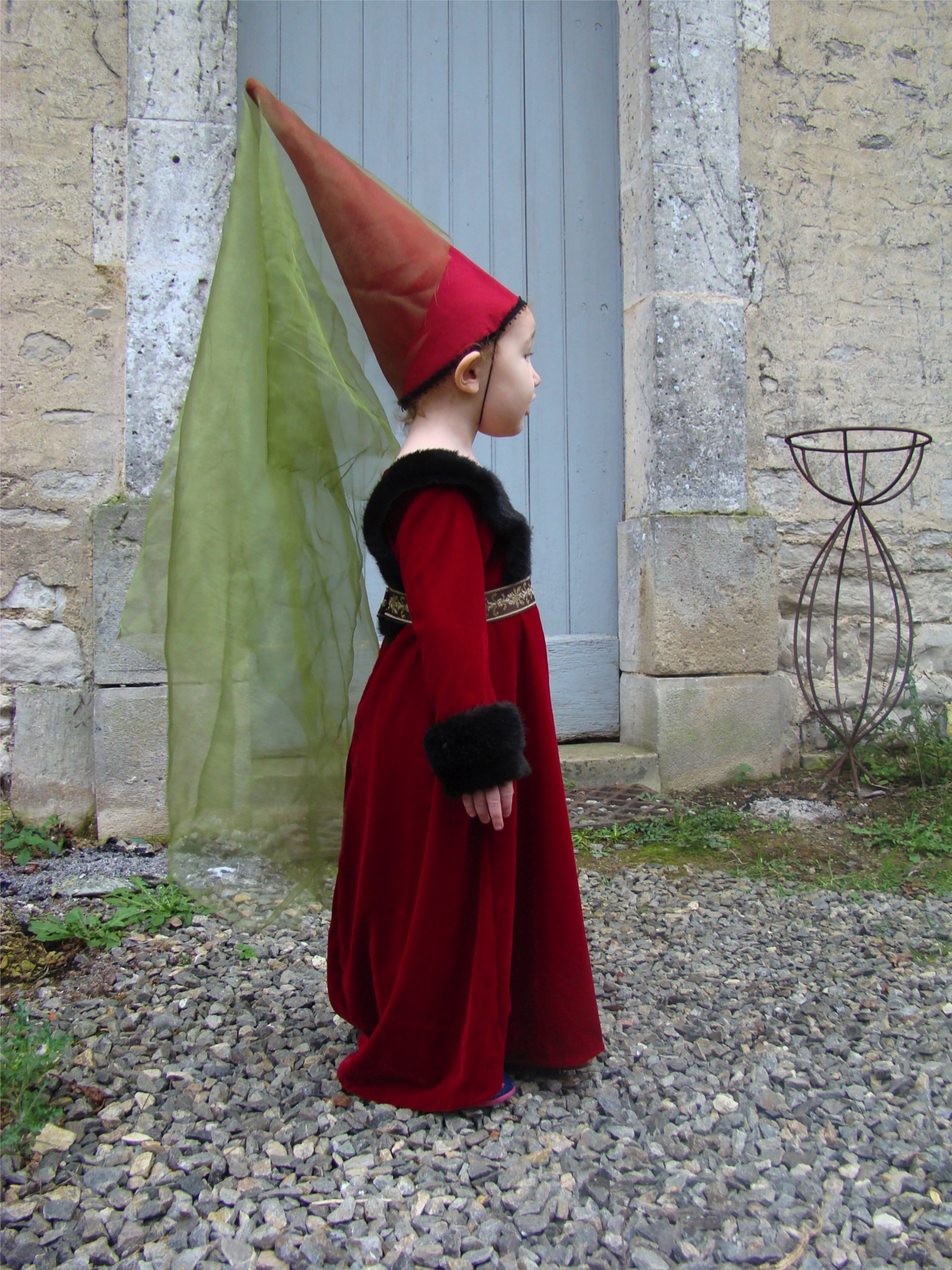 Medieval costum girl with pointy hat
